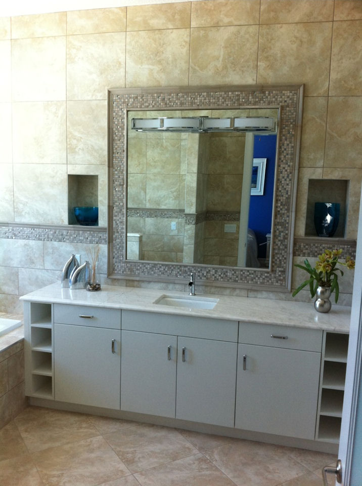 Bathroom with imported glass tile, custom made cabinets, and marble countertops